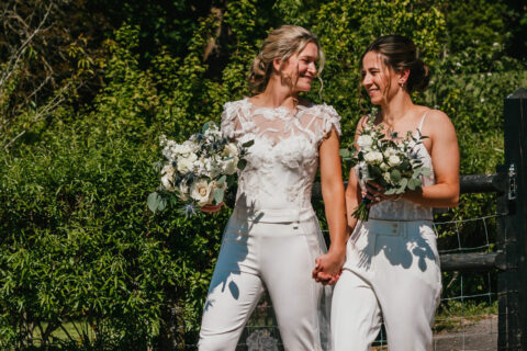A&C(503) lgbtq+ couple walking after their ceremony